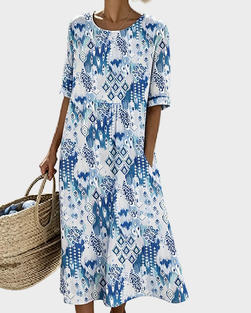 Emma - Luźna i lekka sukienka midi w kwiaty